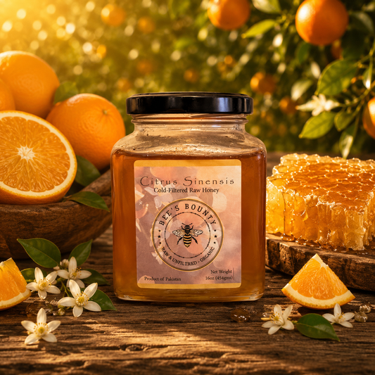 Jar of 'Citrus Sinensis' honey with oranges and honeycomb on a wooden surface